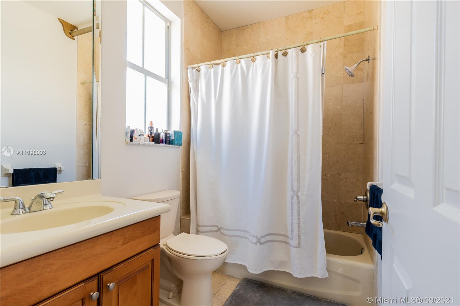 12171 Southwest 122nd Path Miami, FL 33186 - Photo 15 of 16 a bathroom with a sink a toilet and shower