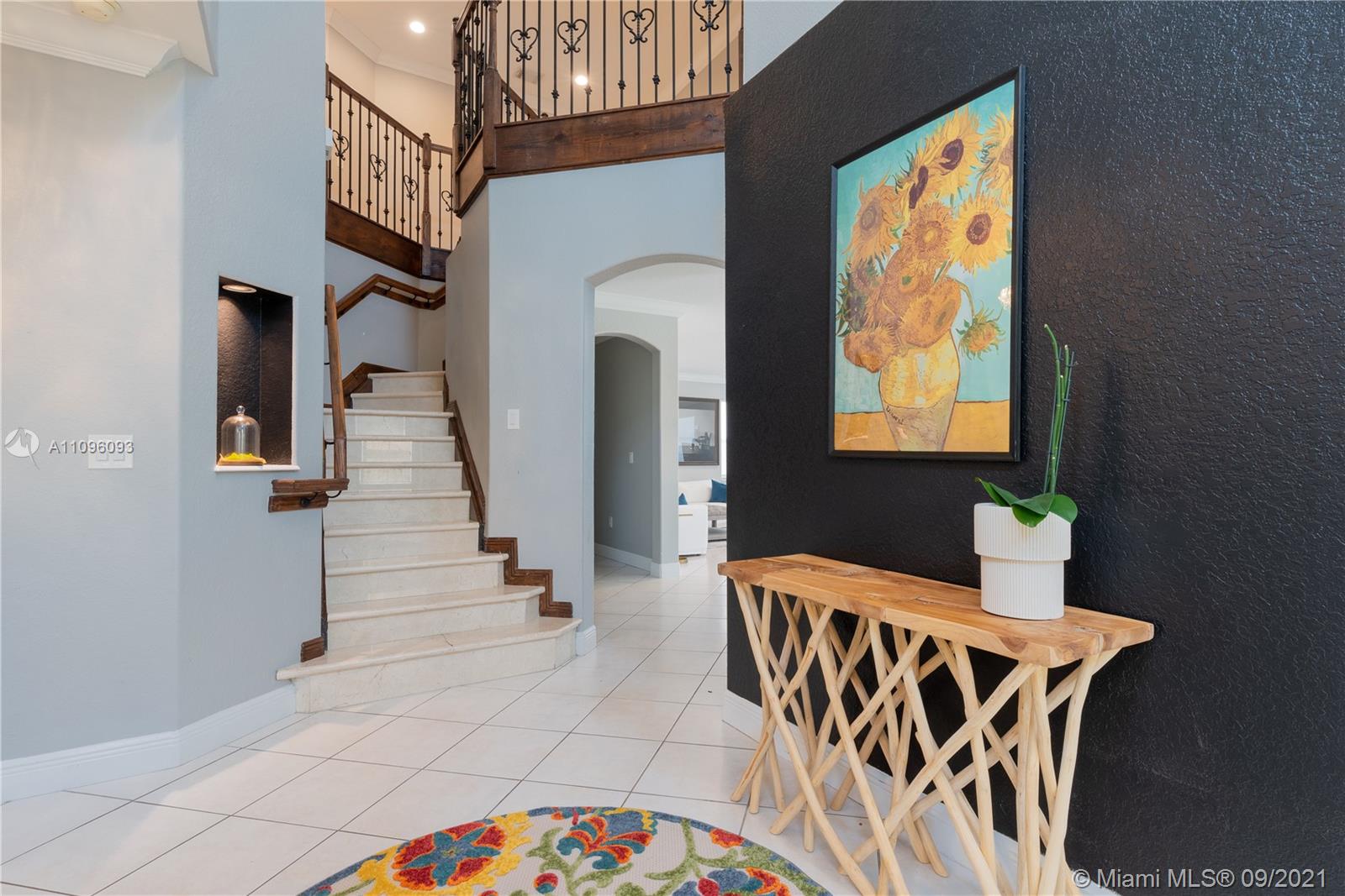 12171 Southwest 122nd Path Miami, FL 33186 - Photo 4 of 16 a view of an chairs and table in the balcony