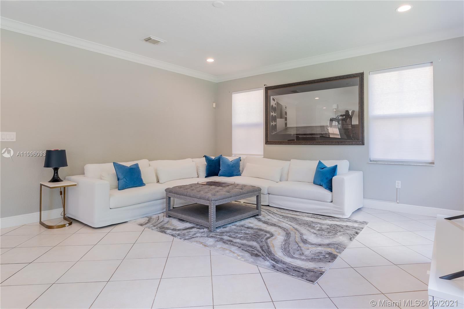 12171 Southwest 122nd Path Miami, FL 33186 - Photo 7 of 16 a living room with furniture and a painting
