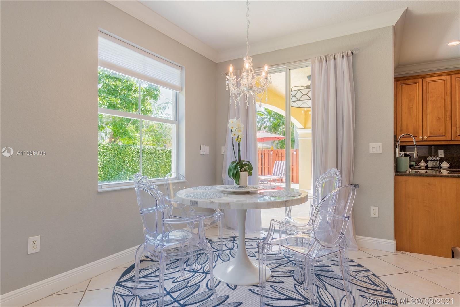 12171 Southwest 122nd Path Miami, FL 33186 - Photo 8 of 16 a dining room with furniture and a window