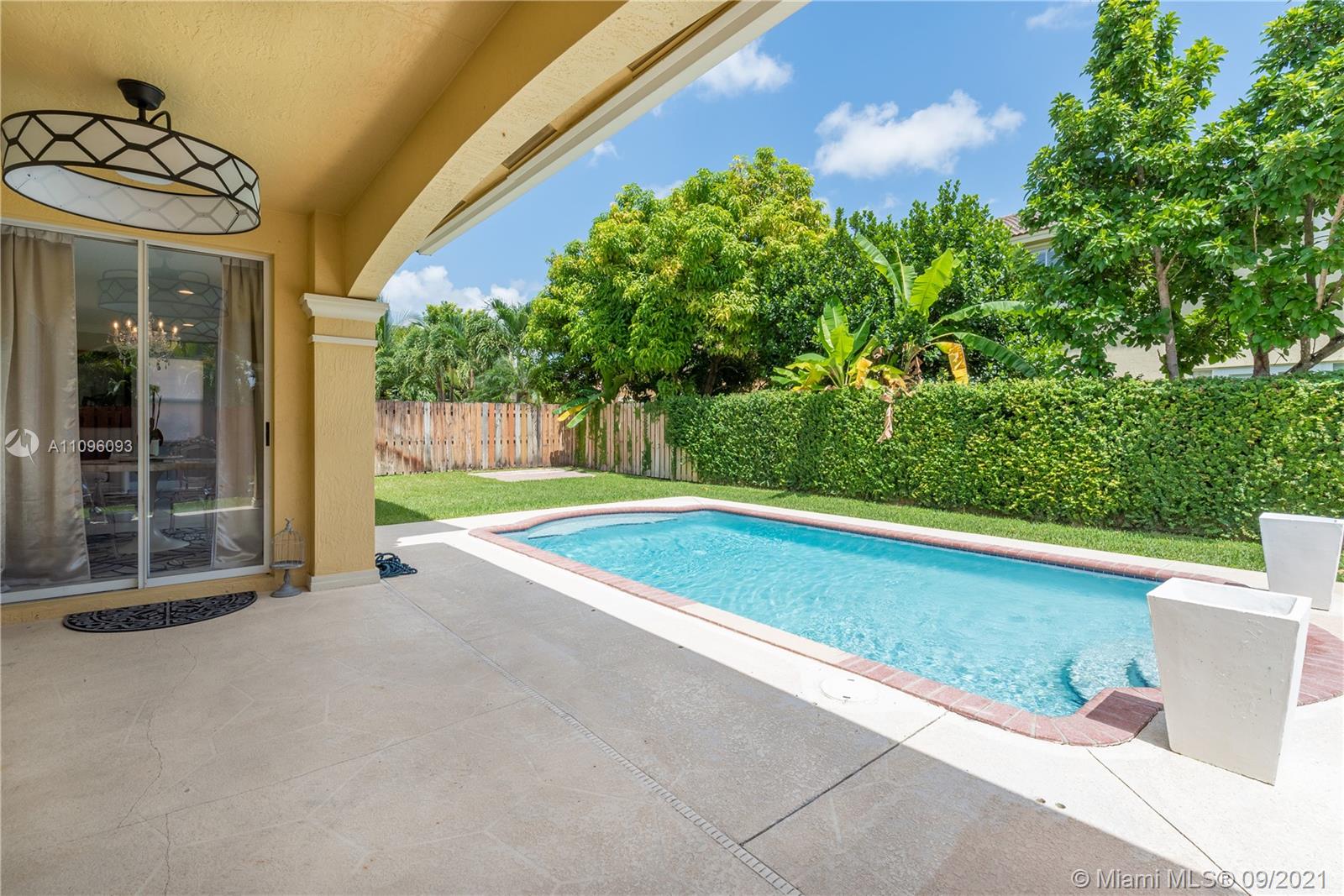 12171 Southwest 122nd Path Miami, FL 33186 - Photo 10 of 16 a view of a building with a swimming pool