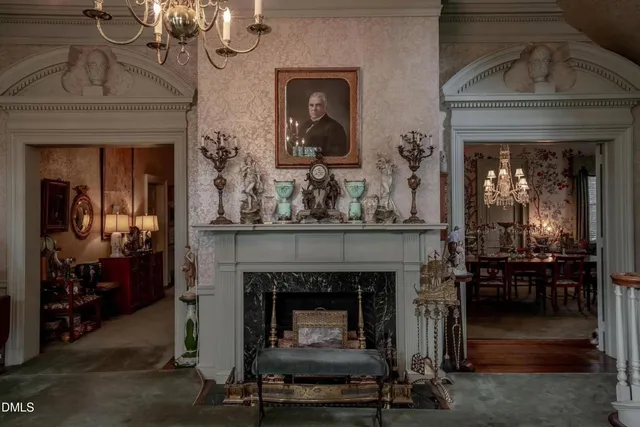 an outdoor living area with furniture and a fireplace