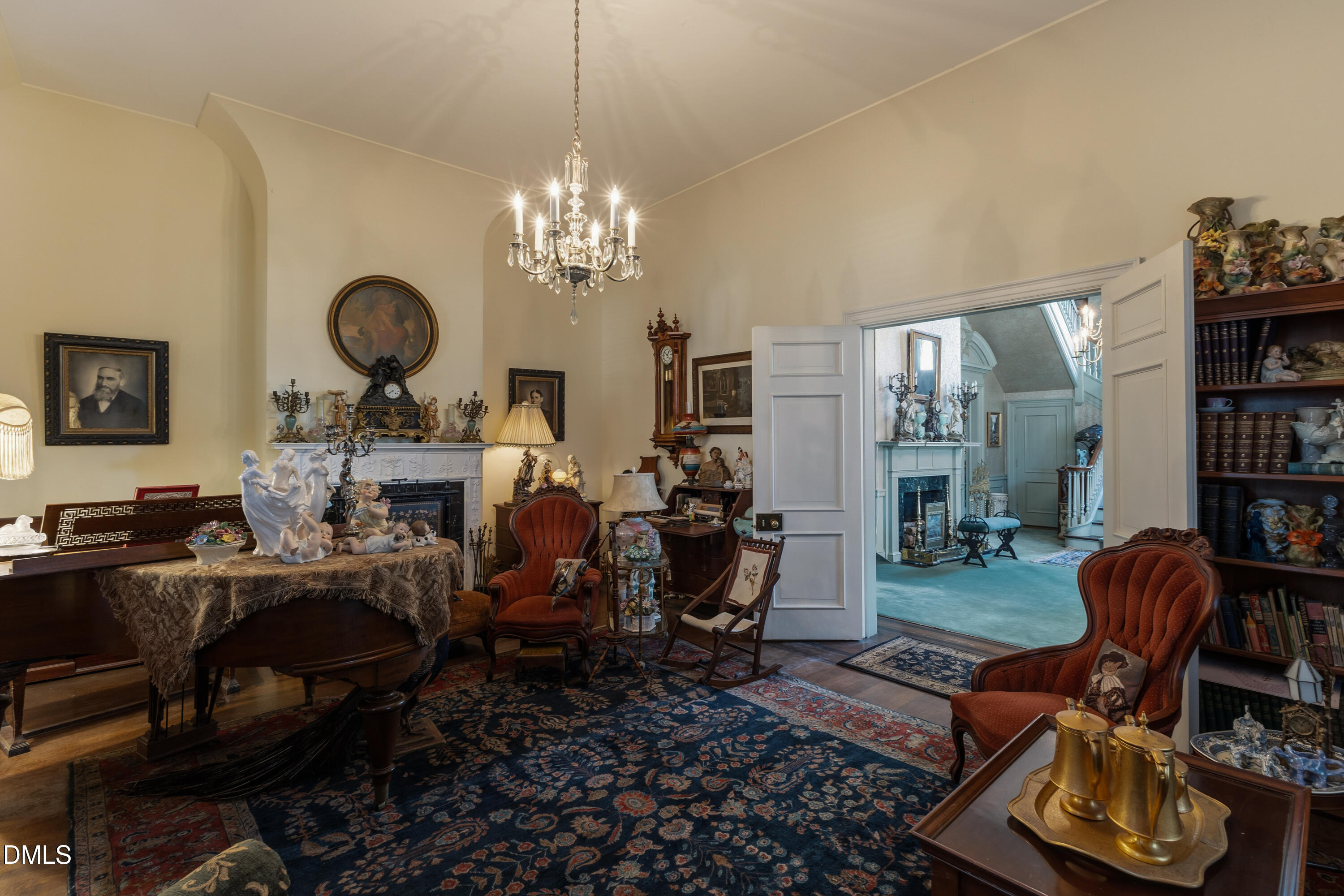 900 Nash Street North Wilson, NC 27893 - Photo 17 of 99 a living room with furniture a chandelier and a bookshelf