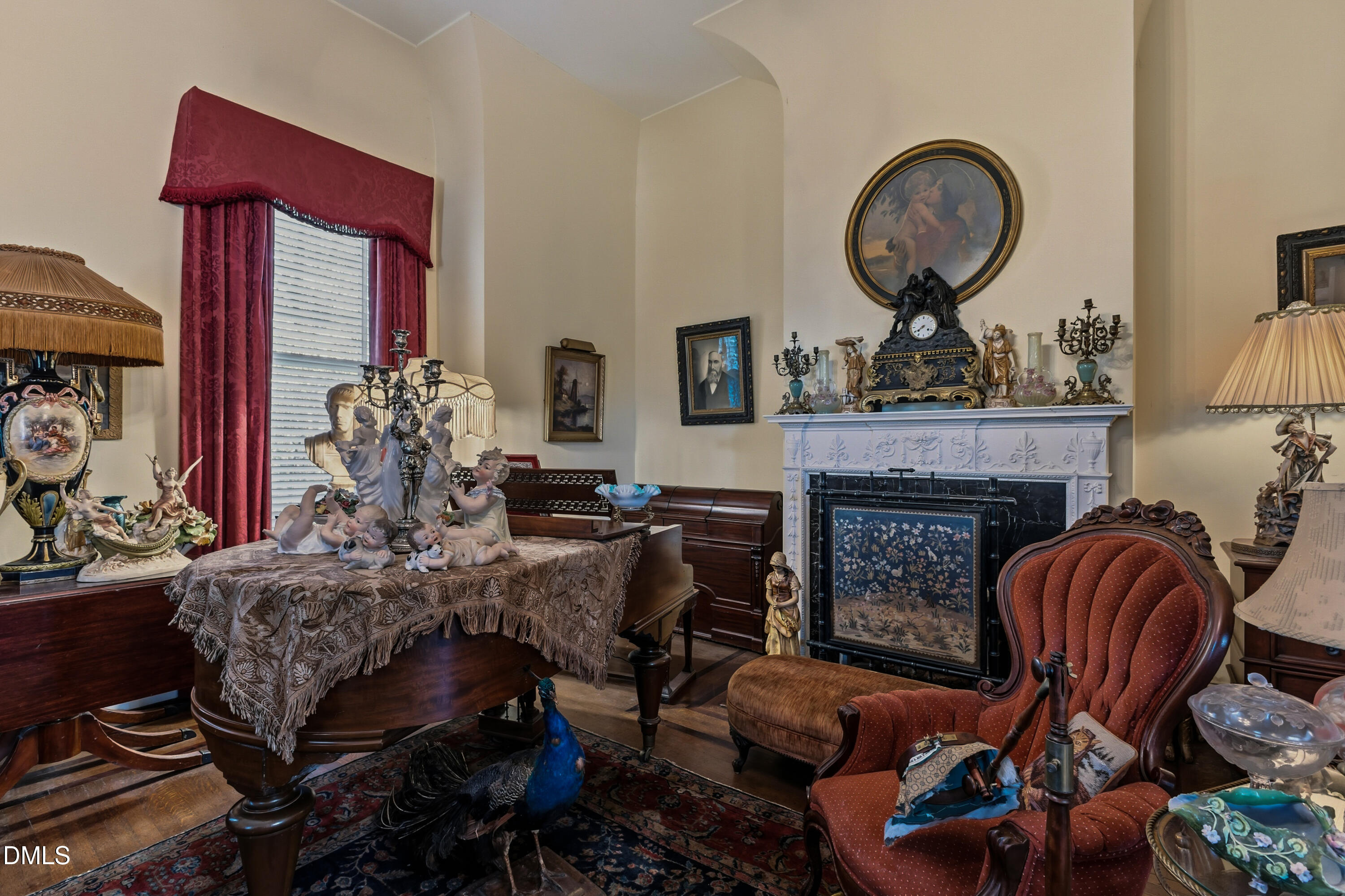 900 Nash Street North Wilson, NC 27893 - Photo 18 of 99 a living room with furniture a fireplace and a large window