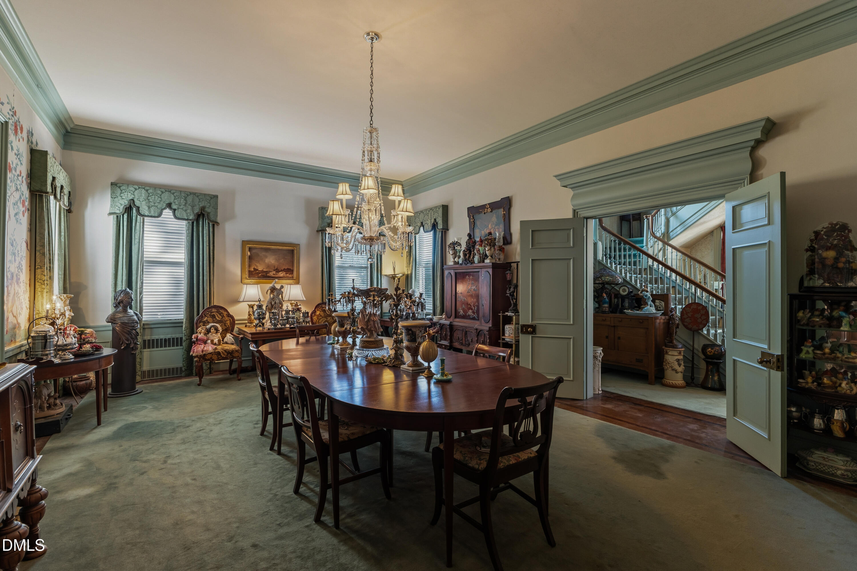 900 Nash Street North Wilson, NC 27893 - Photo 19 of 99 a view of a dining room with furniture and chandelier