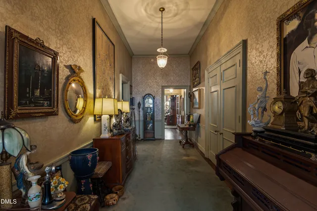 a bedroom with bed and a large window