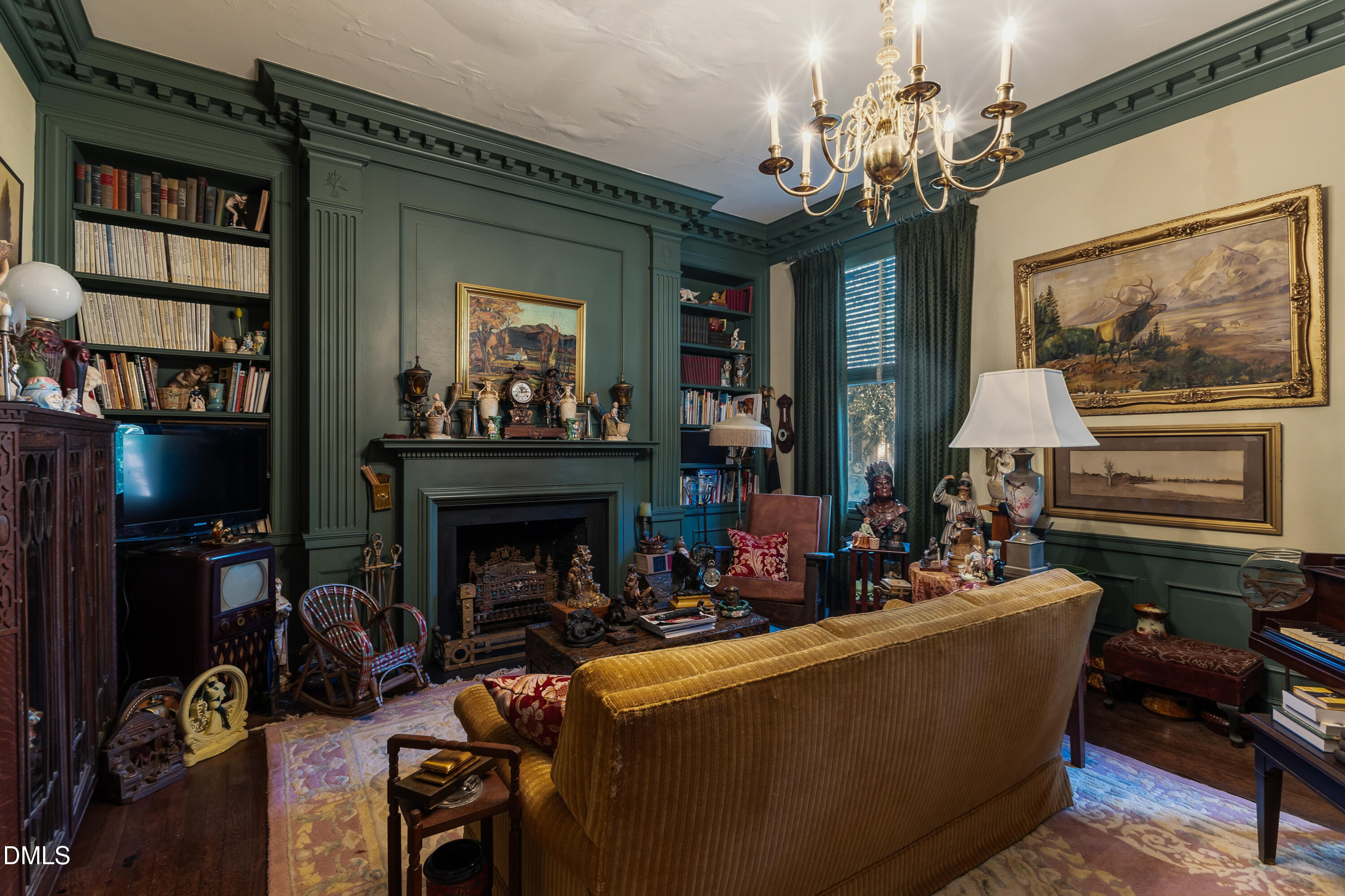 900 Nash Street North Wilson, NC 27893 - Photo 26 of 99 a living room with furniture a chandelier and a fireplace