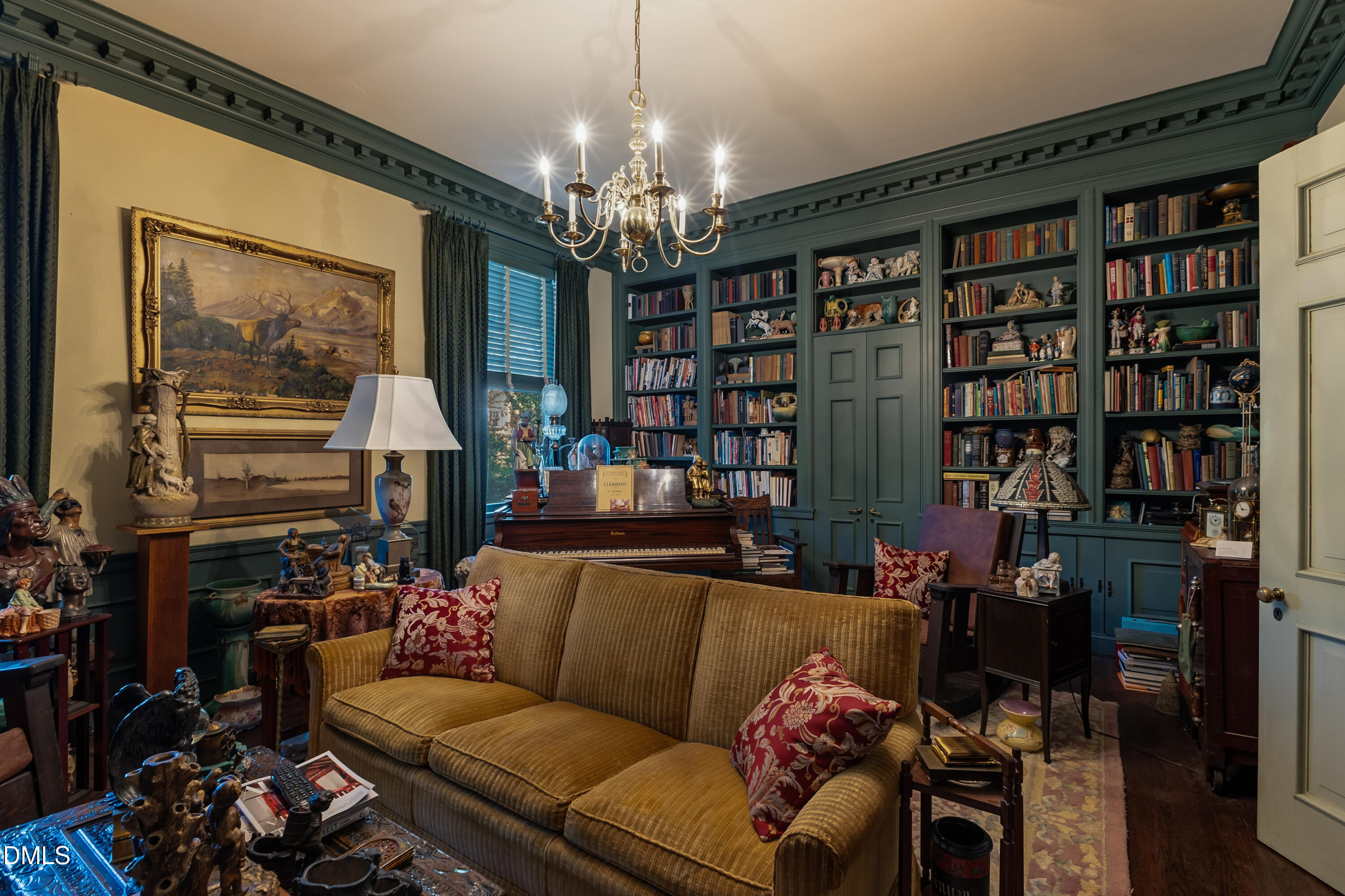 900 Nash Street North Wilson, NC 27893 - Photo 27 of 99 a living room with lots of furniture and a chandelier