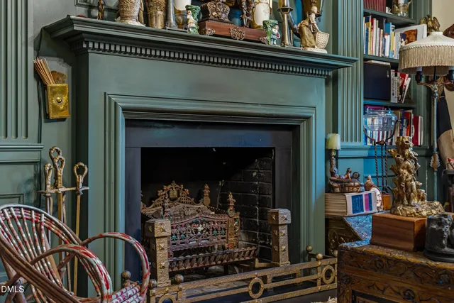 a bedroom with a bed and a fireplace