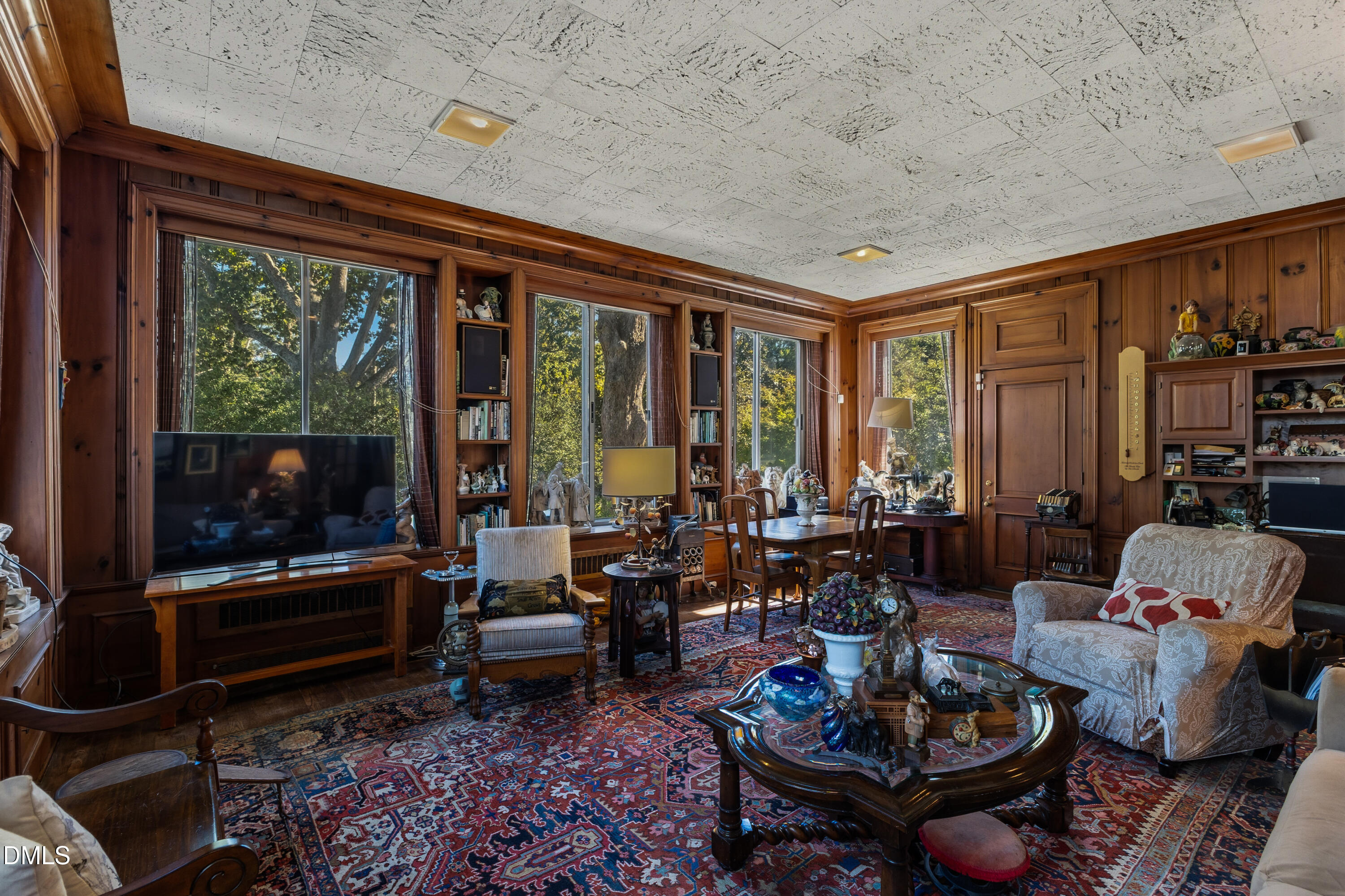 900 Nash Street North Wilson, NC 27893 - Photo 34 of 99 a living room with furniture and a floor to ceiling window