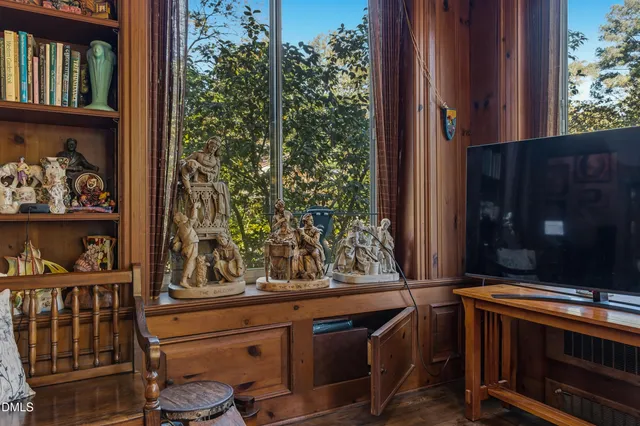 a front view of a house with a yard garage and outdoor seating