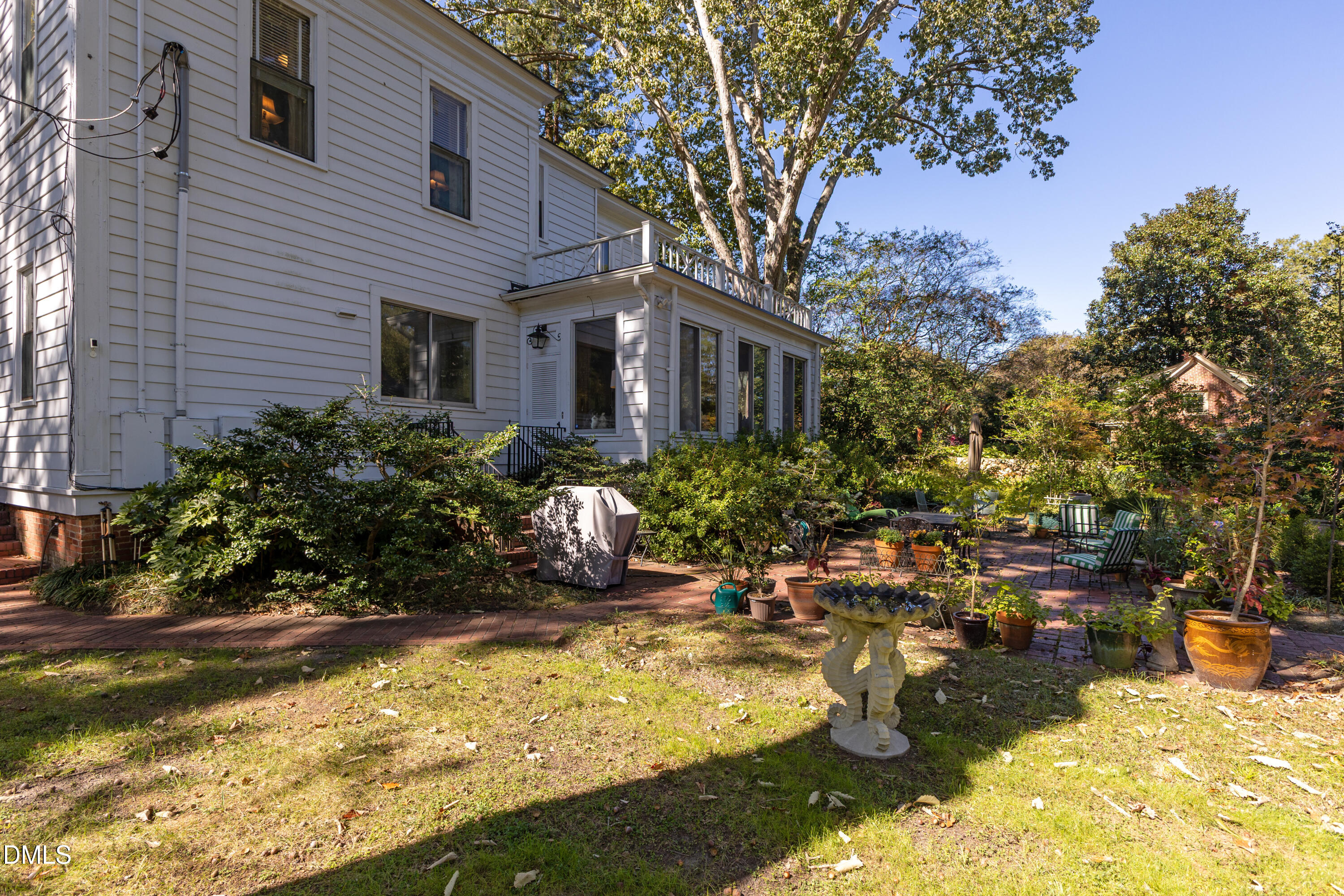 900 Nash Street North Wilson, NC 27893 - Photo 74 of 99 a front view of a house with a yard garage and outdoor seating