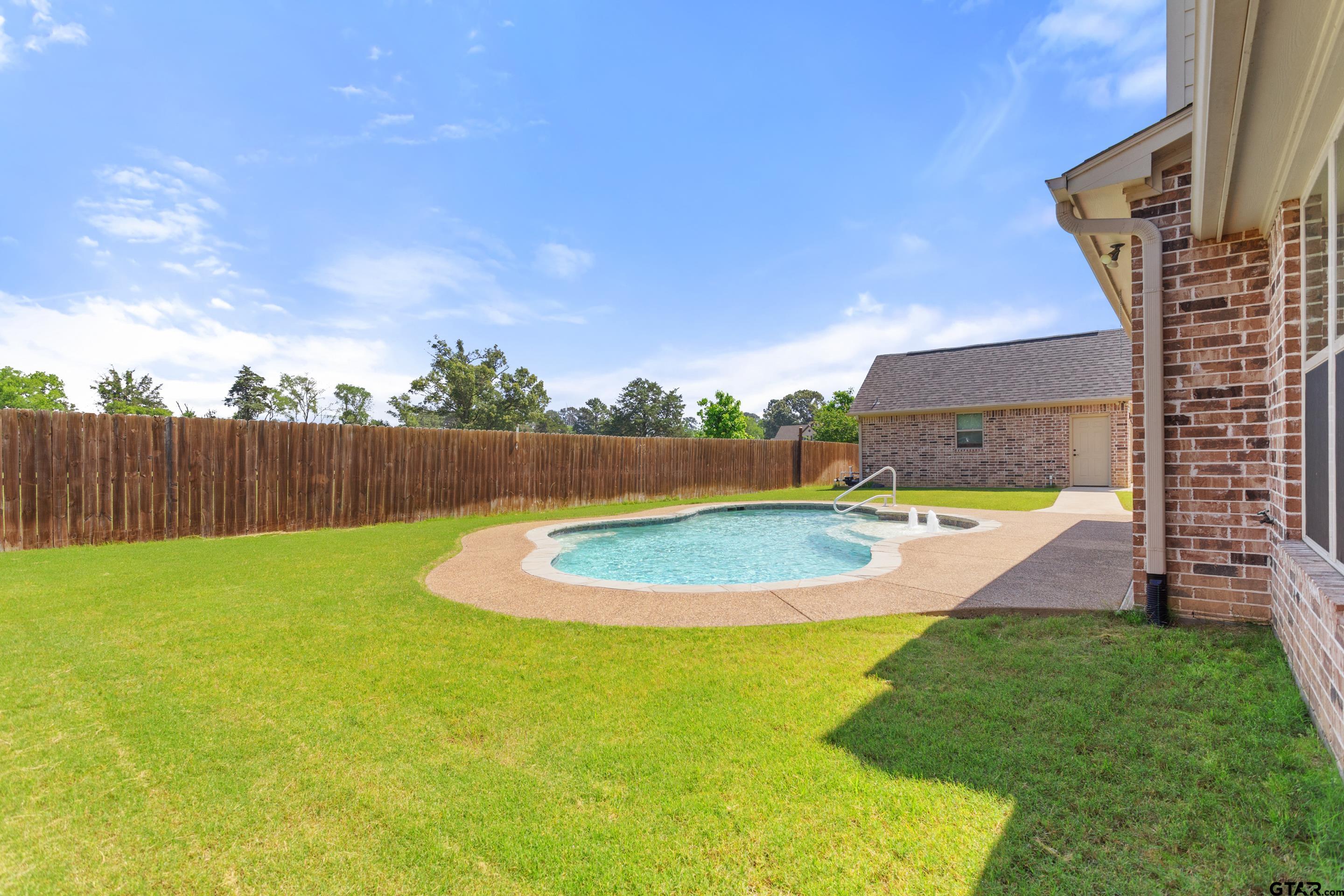 105 Nathan Road Chandler, TX 75758 - Photo 32 of 36 a view of yard with swimming pool