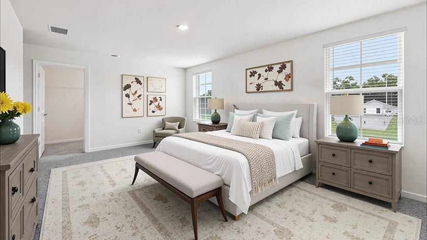 10562 Tucker Road Weeki Wachee, FL 34613 - Photo 6 of 16 a spacious bedroom with a bed and a couch