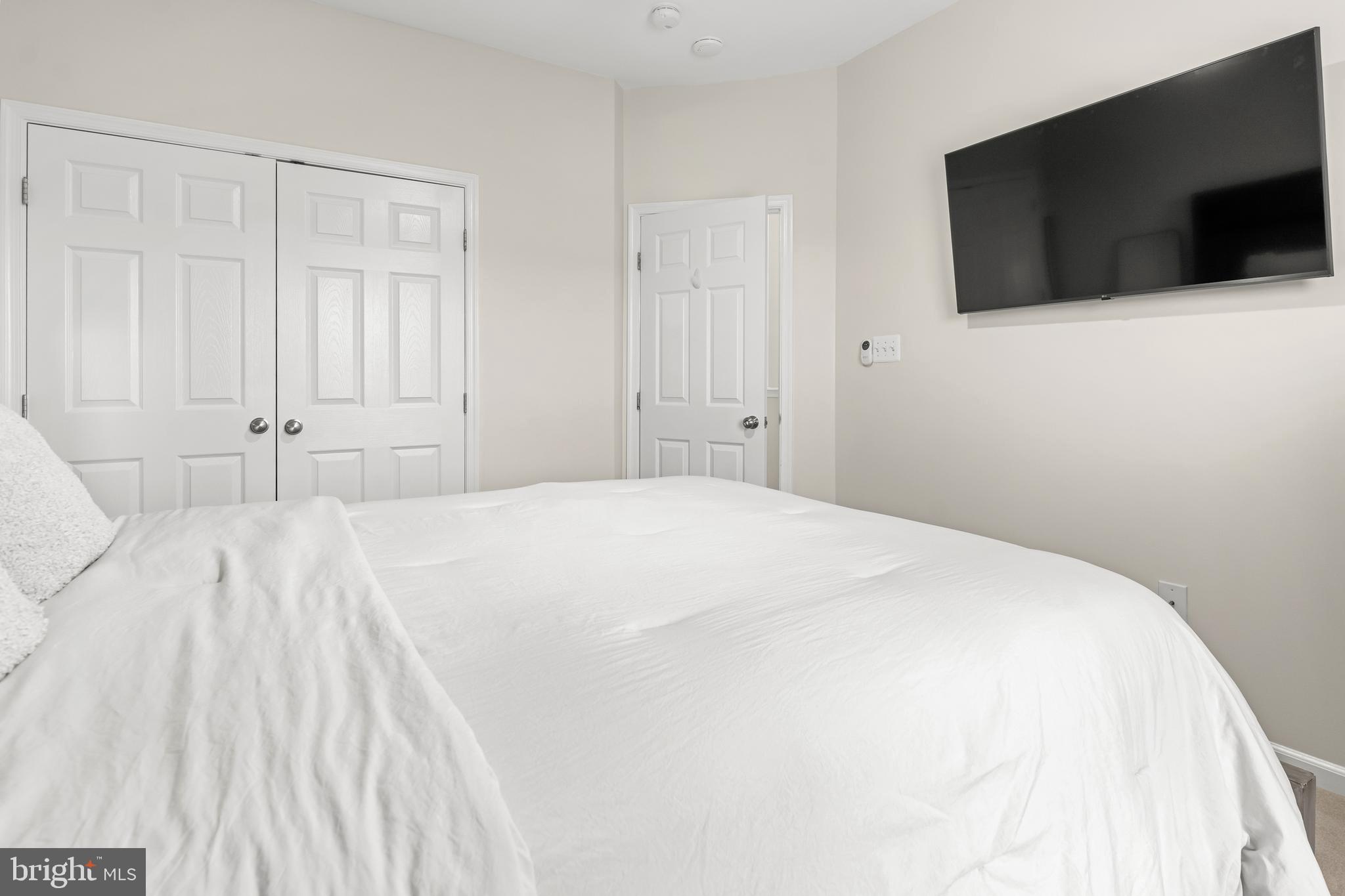 1750 Theale Way Hanover, MD 21076 - Photo 37 of 42 a bedroom with a bed and a flat screen tv