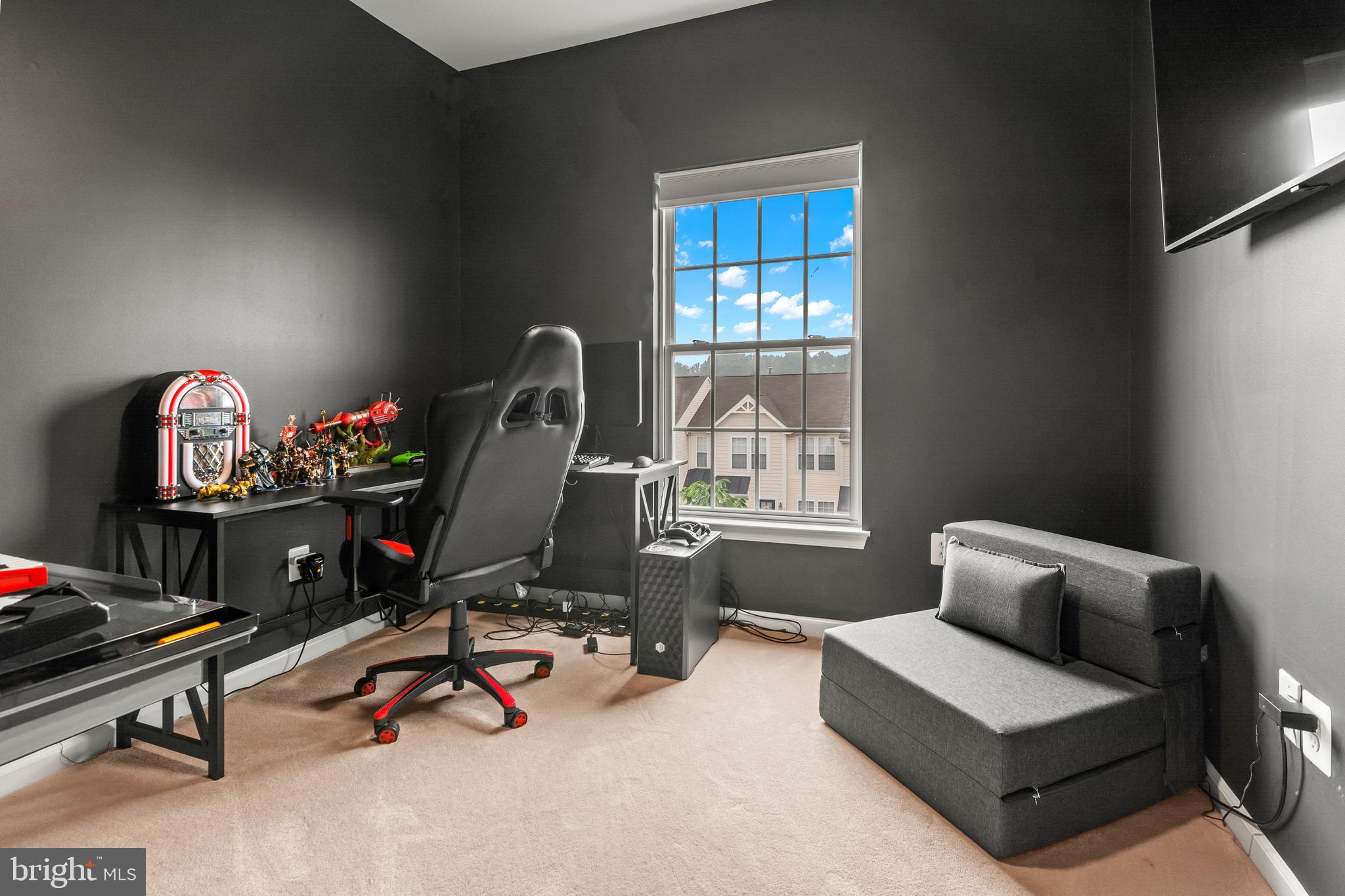 1750 Theale Way Hanover, MD 21076 - Photo 39 of 42 a living room with furniture gym equipment and a flat screen tv