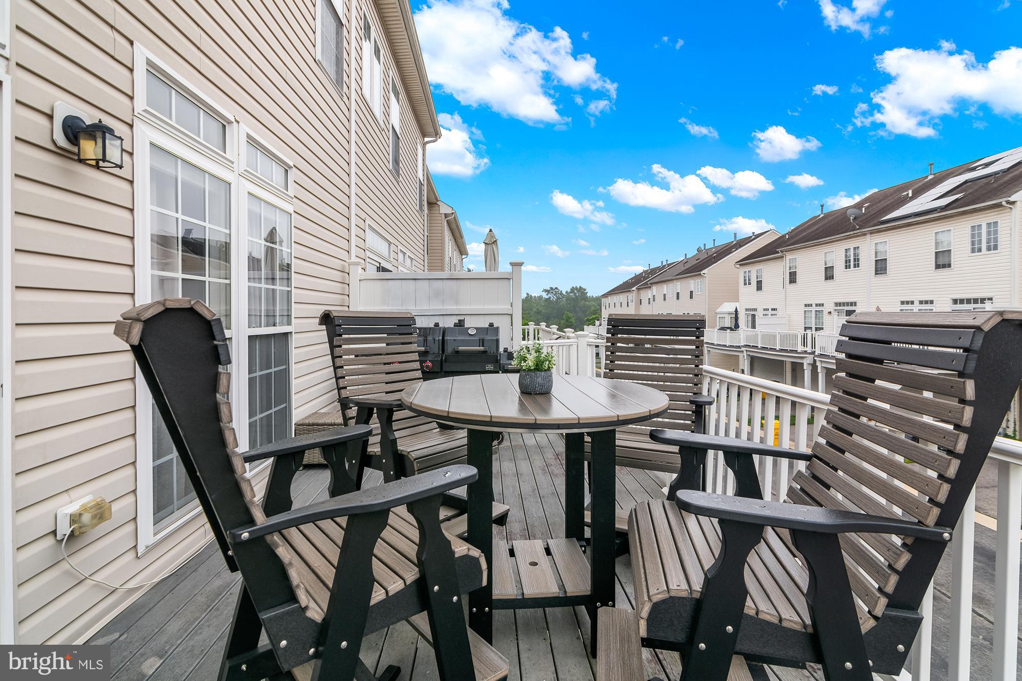 1750 Theale Way Hanover, MD 21076 - Photo 40 of 42 a view of balcony with dining table and chairs