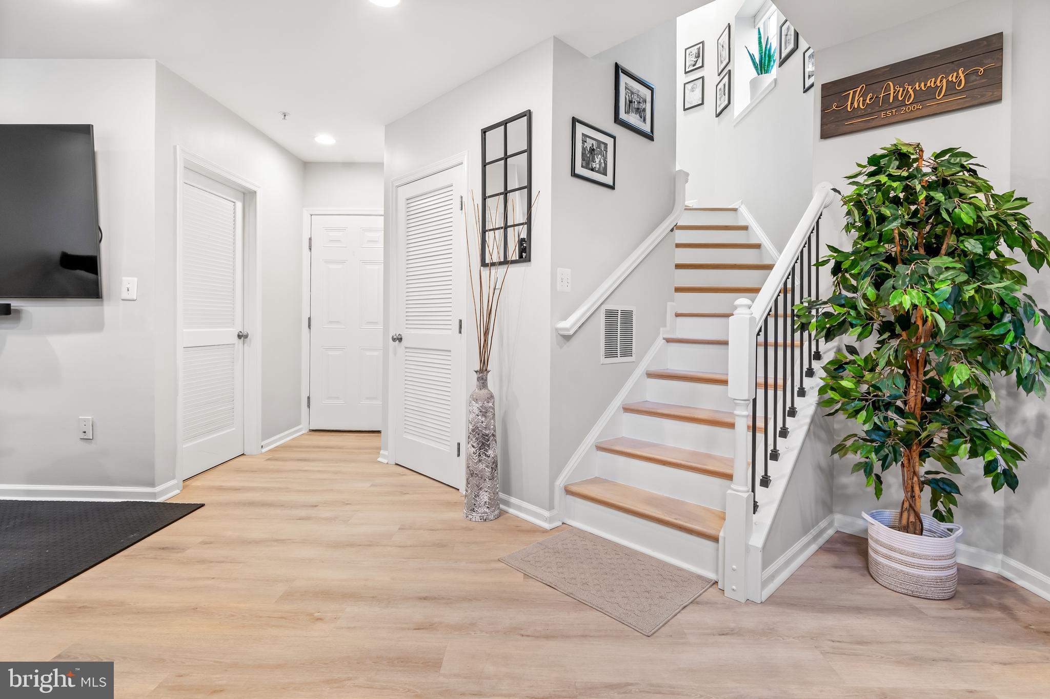1750 Theale Way Hanover, MD 21076 - Photo 6 of 42 a view of entryway with stairs and wooden floor