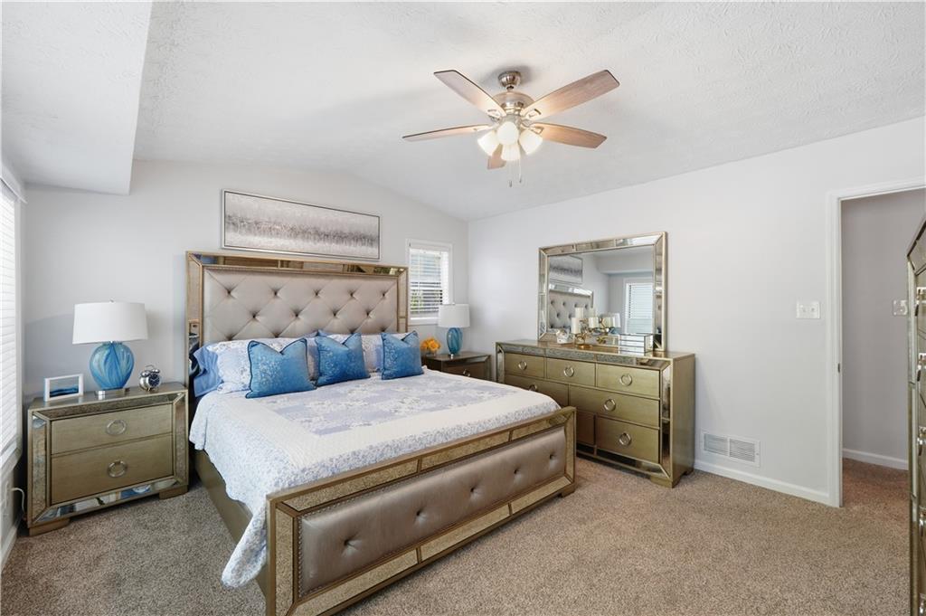 5421 Burdett Road Southeast Mableton, GA 30126 - Photo 24 of 51 a bedroom with a bed and a chandelier