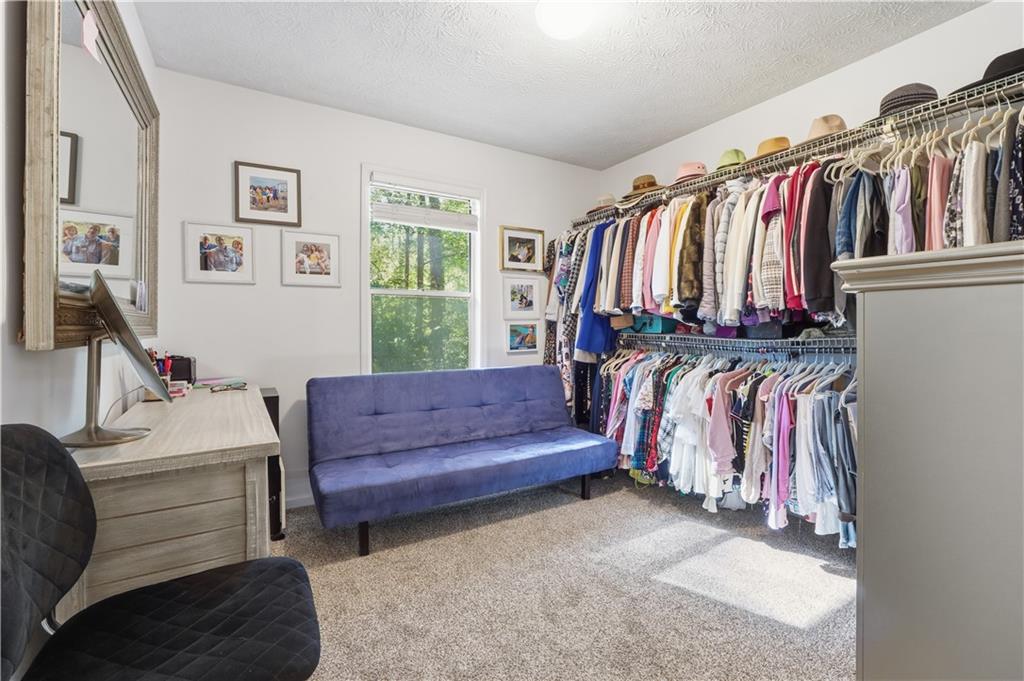 5421 Burdett Road Southeast Mableton, GA 30126 - Photo 27 of 51 a view of a living room with clothes and shoes