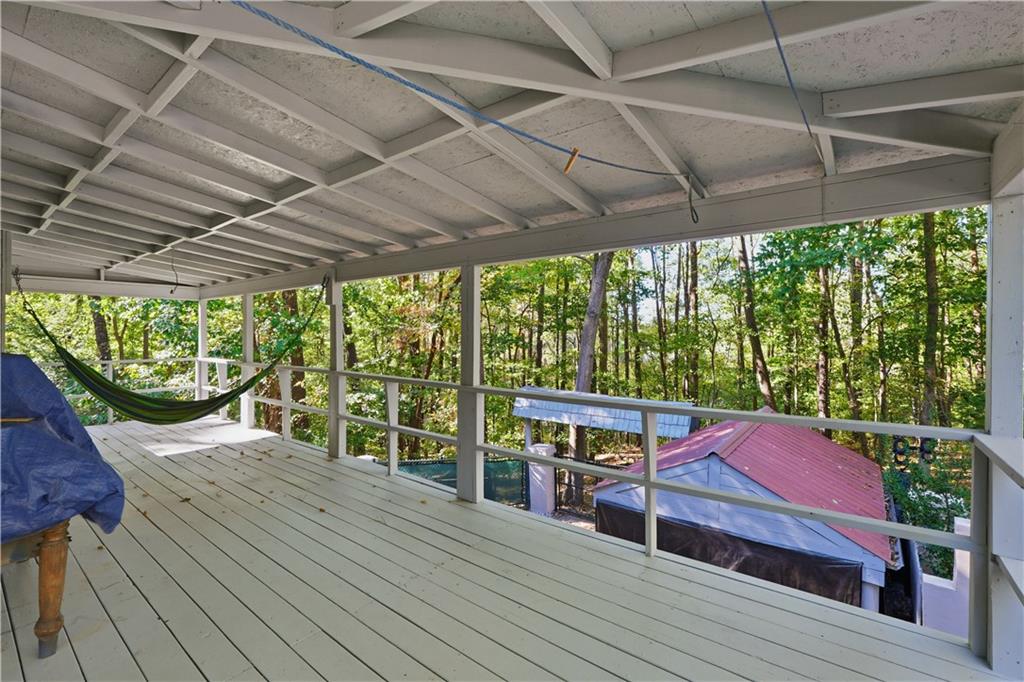 5421 Burdett Road Southeast Mableton, GA 30126 - Photo 34 of 51 a patio with lawn chairs and wooden floor