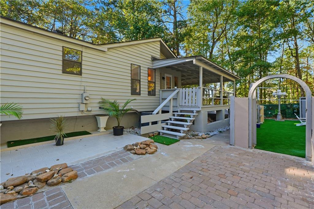 5421 Burdett Road Southeast Mableton, GA 30126 - Photo 39 of 51 a view of a chair and table in backyard of the house