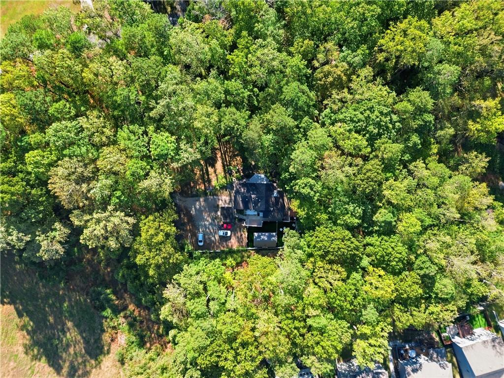 5421 Burdett Road Southeast Mableton, GA 30126 - Photo 47 of 51 a backyard of a house with table and chairs