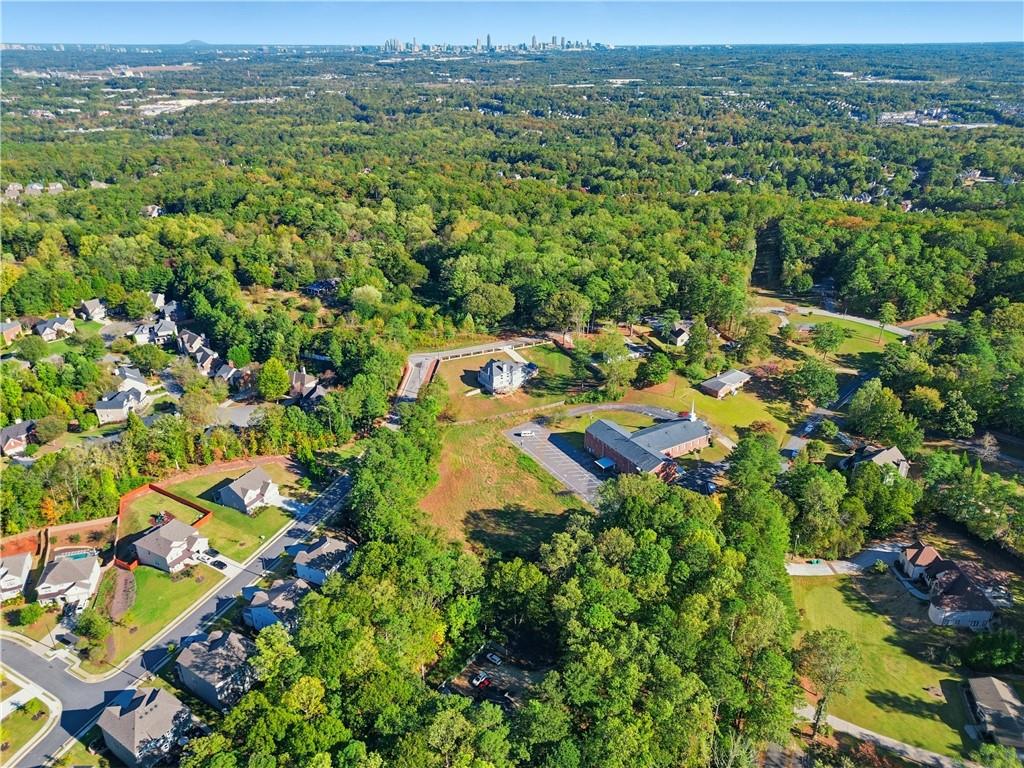 5421 Burdett Road Southeast Mableton, GA 30126 - Photo 48 of 51 an aerial view of a houses with a lush green hillside