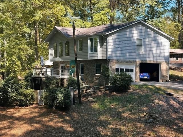 5421 Burdett Road Southeast Mableton, GA 30126 - Photo 7 of 51 a front view of a house with a yard