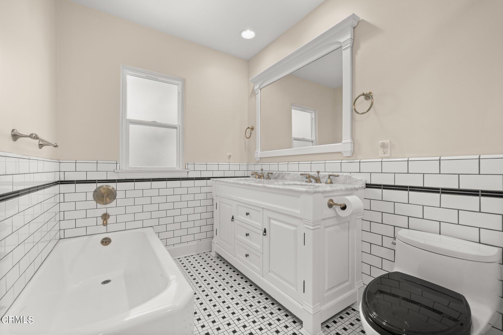 2405 Sylvan Lane Glendale, CA 91208 - Photo 19 of 43 a bathroom with a sink a toilet and vanity