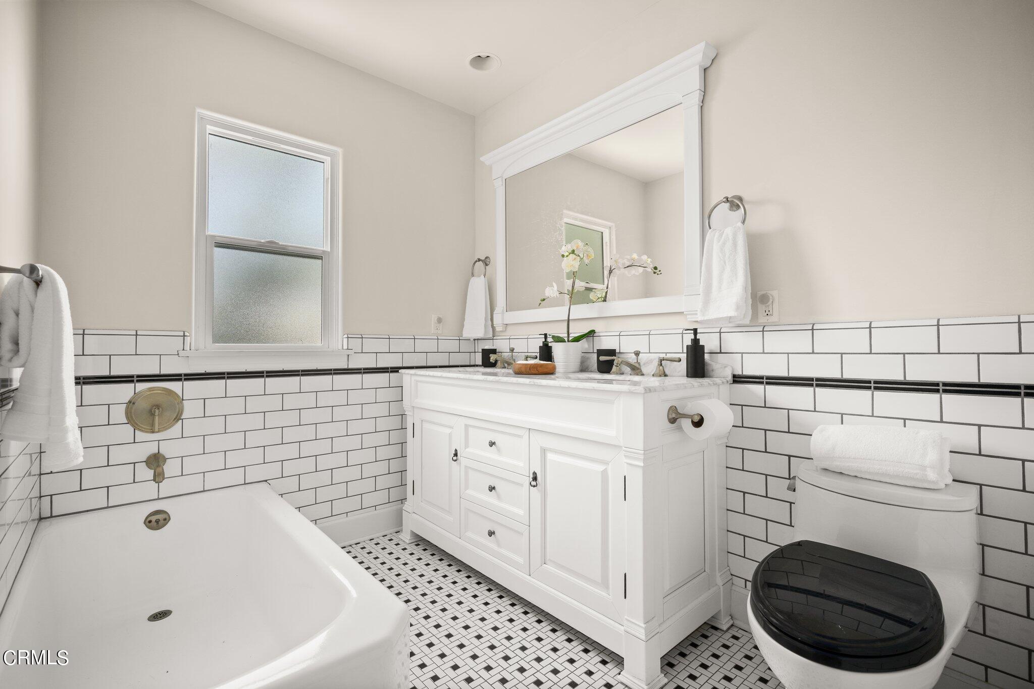 2405 Sylvan Lane Glendale, CA 91208 - Photo 22 of 43 a bathroom with a sink a toilet and vanity