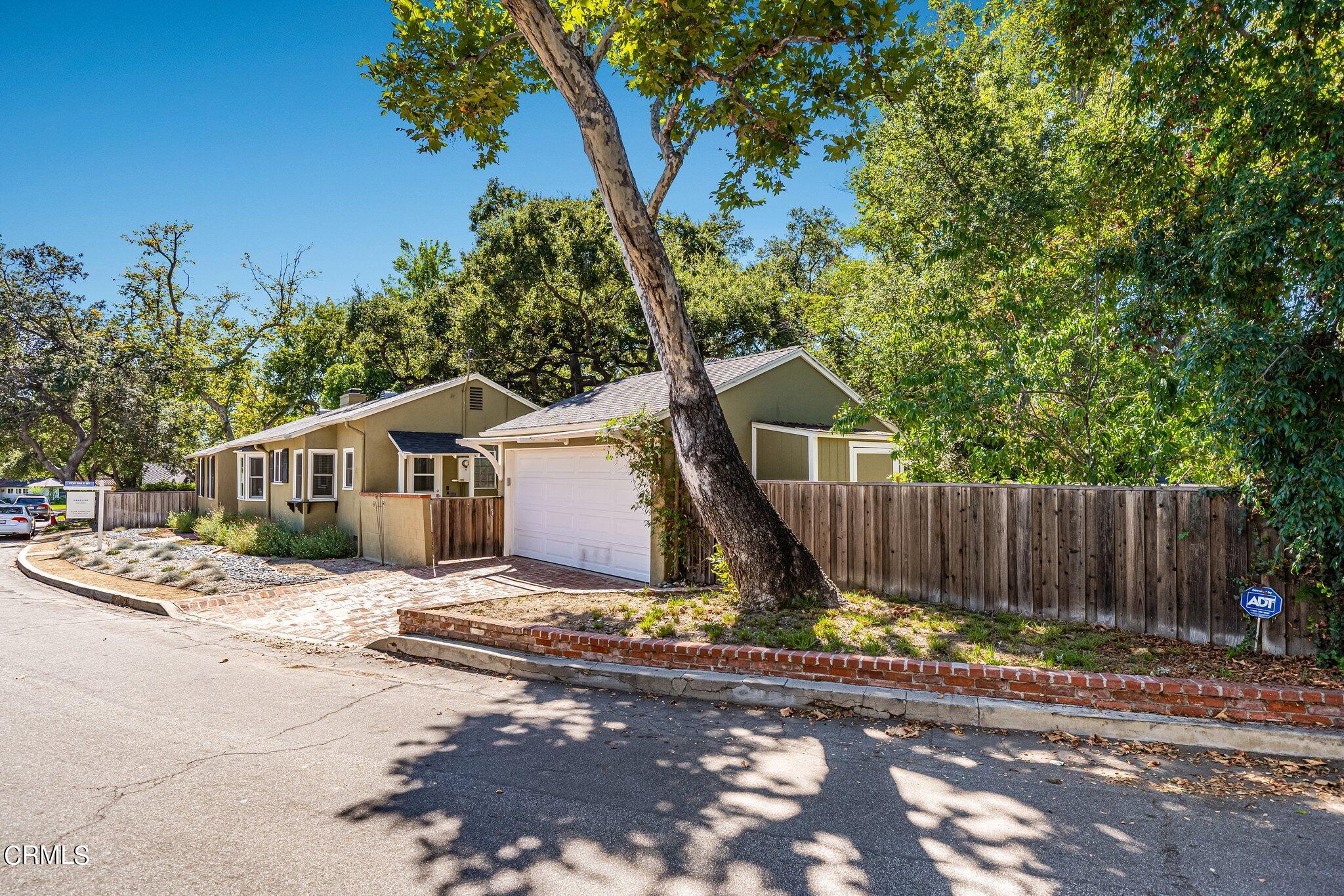 2405 Sylvan Lane Glendale, CA 91208 - Photo 40 of 43 a view of a house with wooden fence next to a road