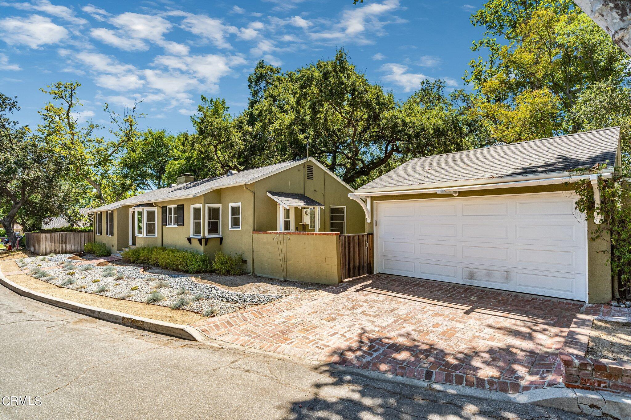 2405 Sylvan Lane Glendale, CA 91208 - Photo 41 of 43 a front view of a house with a yard covered with snow in front of it