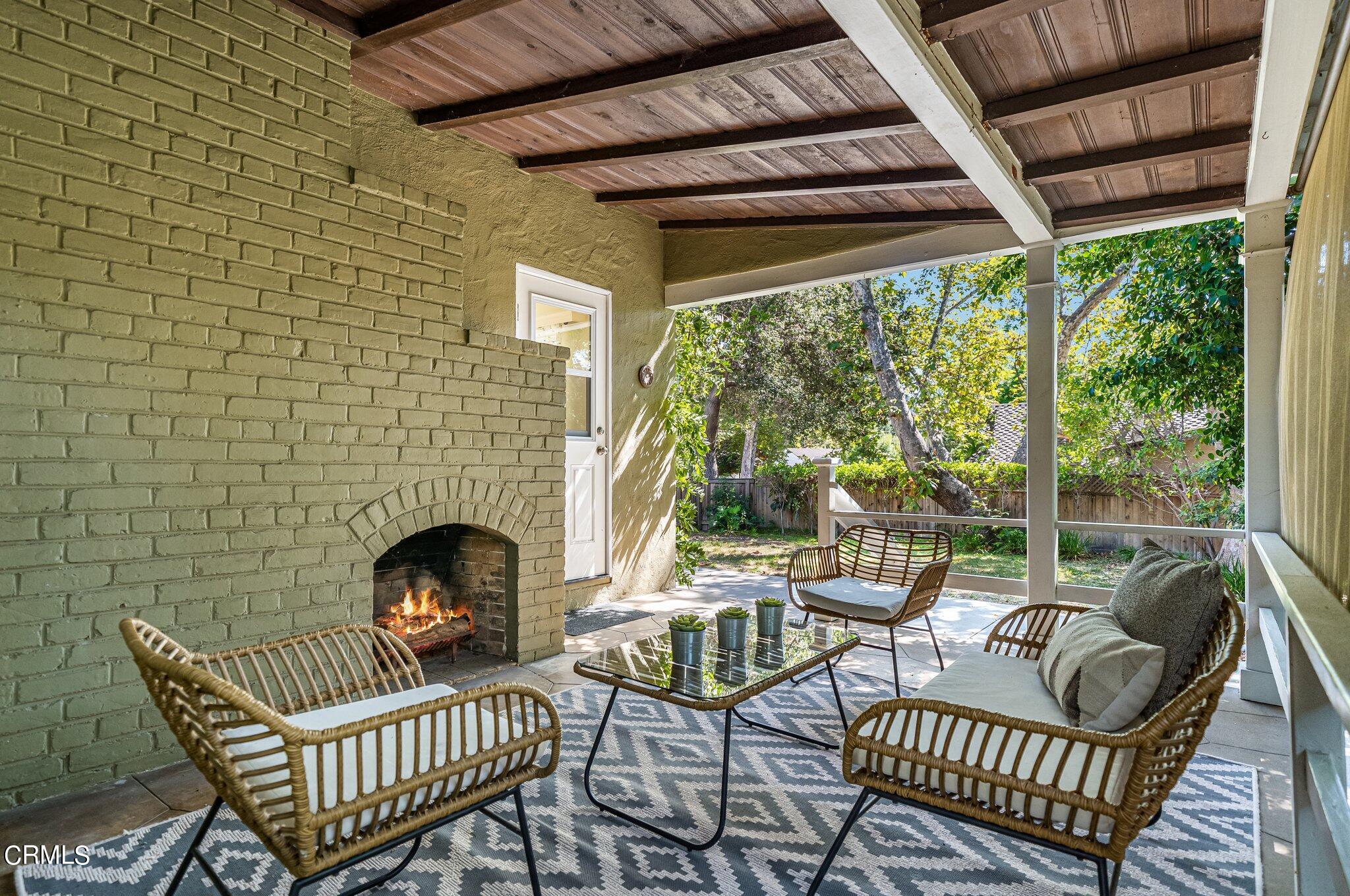 2405 Sylvan Lane Glendale, CA 91208 - Photo 5 of 43 a view of a patio with a chairs and a fireplace