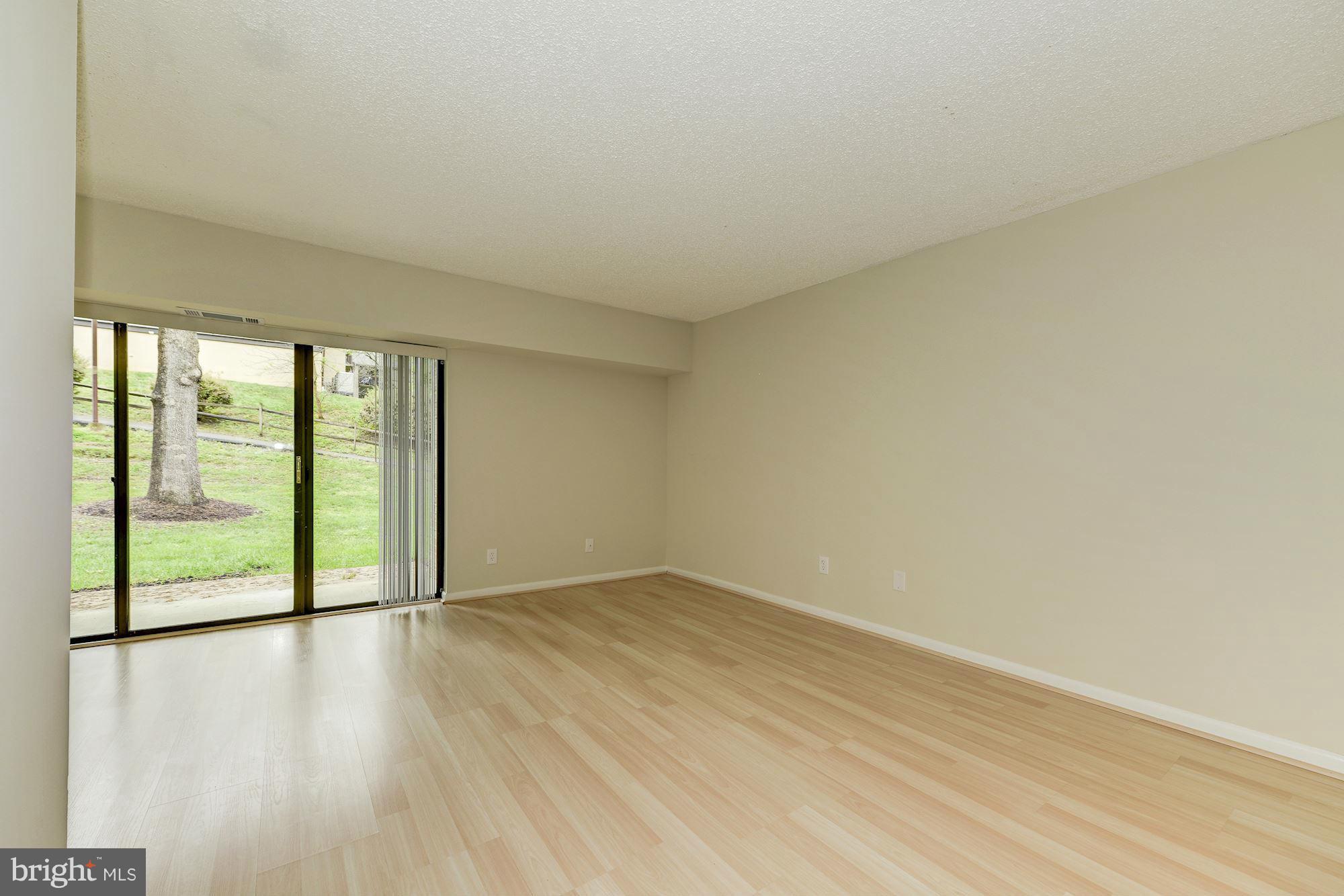 11641 Stoneview Square, Unit 2B Reston, VA 20191 - Photo 17 of 28 Living-Dining RMs to Paio