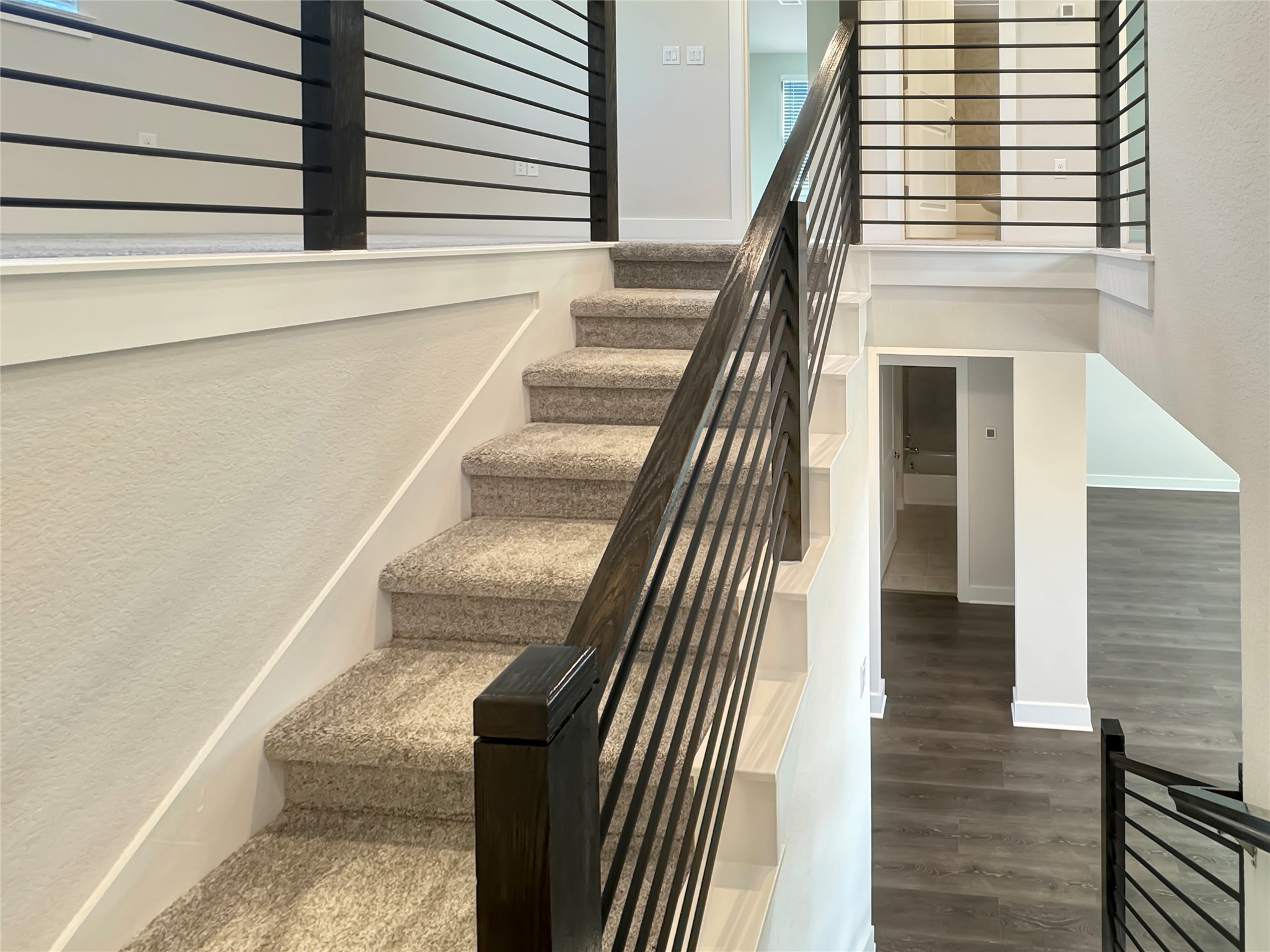 1704 Carvin Way Pflugerville, TX 78660 - Photo 15 of 30 Staircase with wood finished floors and baseboards