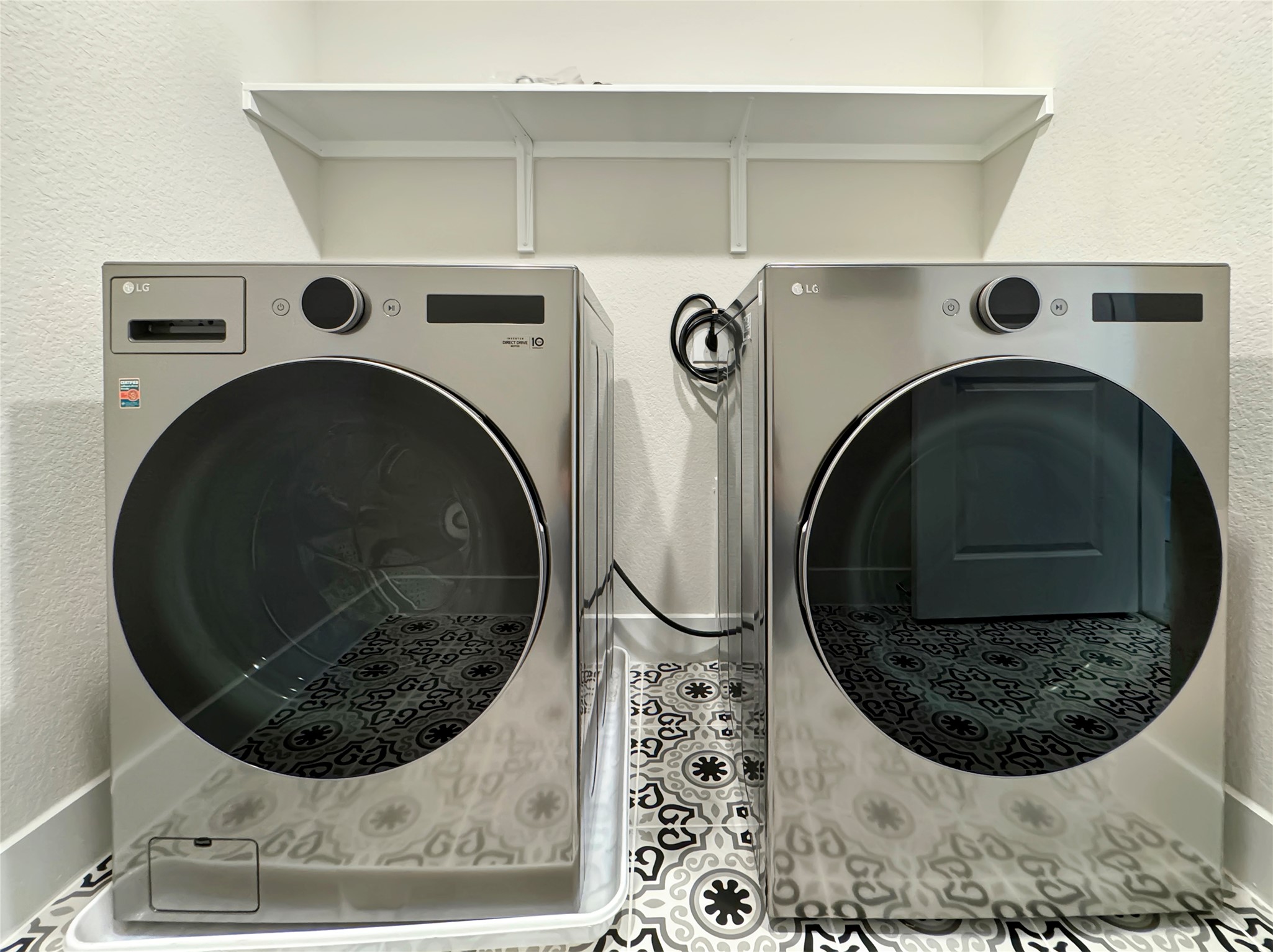 1704 Carvin Way Pflugerville, TX 78660 - Photo 18 of 30 Upstairs Laundry room with a textured wall and washing machine and dryer