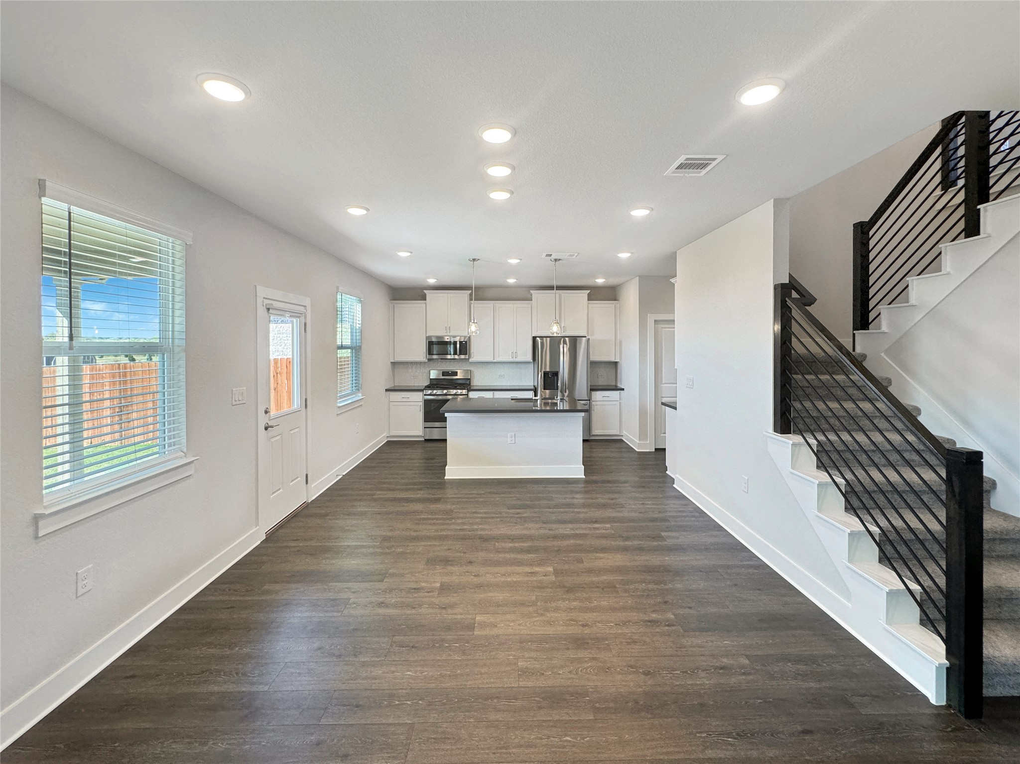 1704 Carvin Way Pflugerville, TX 78660 - Photo 7 of 30 Looking towards dining and kitchen from the living room.