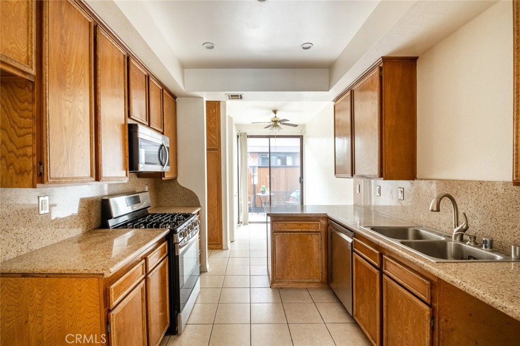 1244 Valley View Road, Unit 129 Glendale, CA 91202 - Photo 13 of 42 a kitchen with stainless steel appliances a sink stove and cabinets