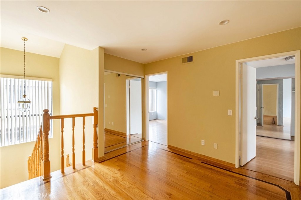 1244 Valley View Road, Unit 129 Glendale, CA 91202 - Photo 20 of 42 a view of a hallway with wooden floor and cabinet