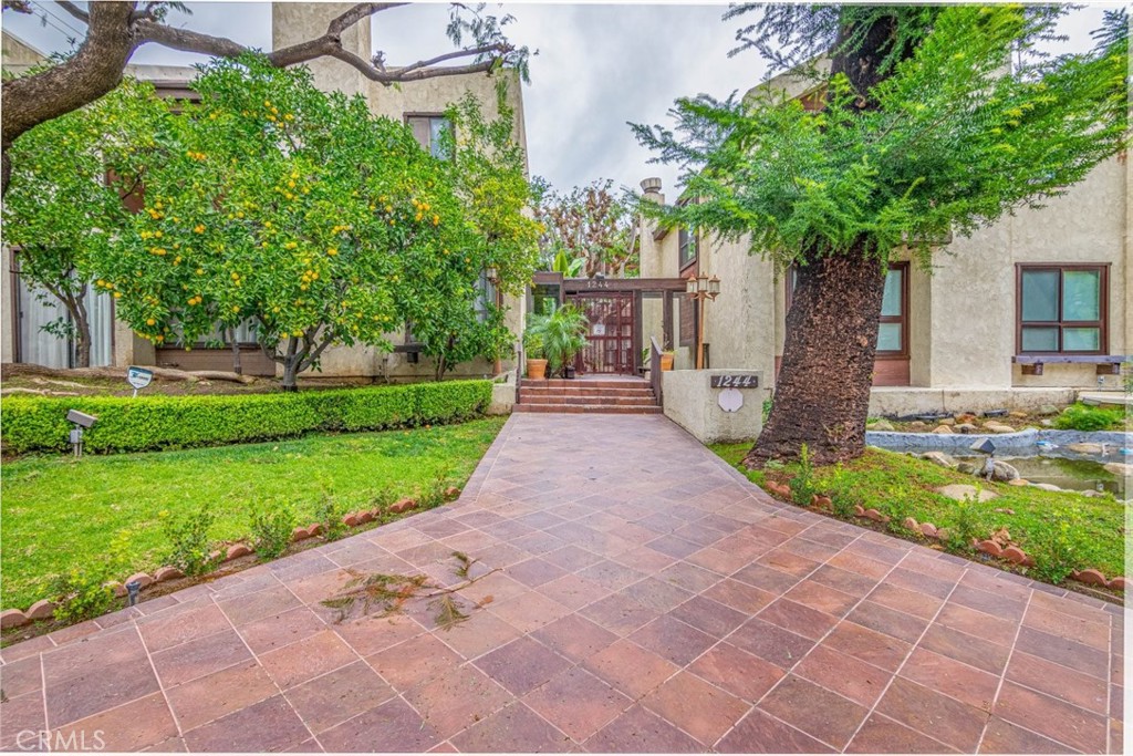 1244 Valley View Road, Unit 129 Glendale, CA 91202 - Photo 2 of 42 a front view of a house with garden