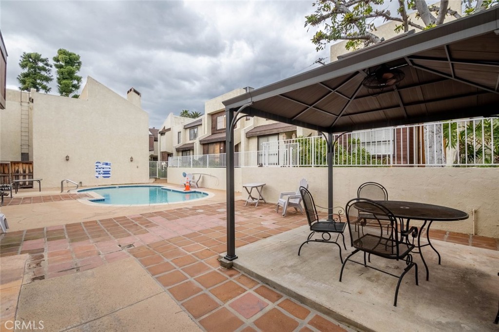 1244 Valley View Road, Unit 129 Glendale, CA 91202 - Photo 30 of 42 a patio with a table and chairs