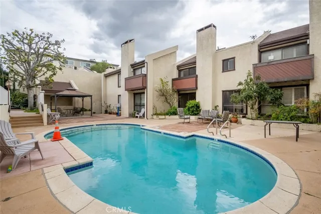 a view of a swimming pool with a lounge chairs