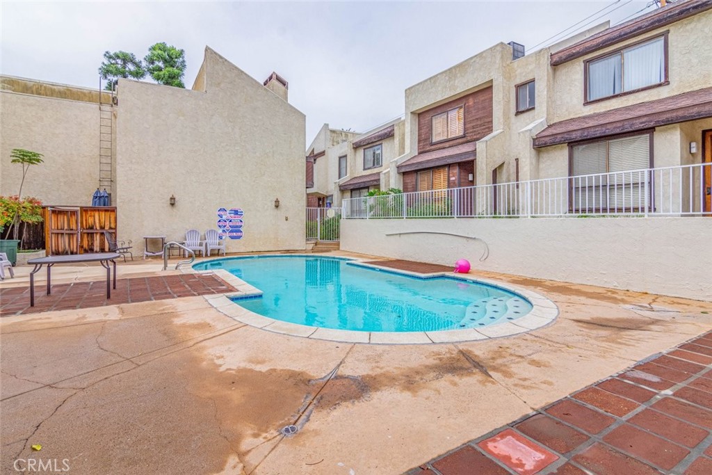 1244 Valley View Road, Unit 129 Glendale, CA 91202 - Photo 33 of 42 a view of a swimming pool with a lounge chairs
