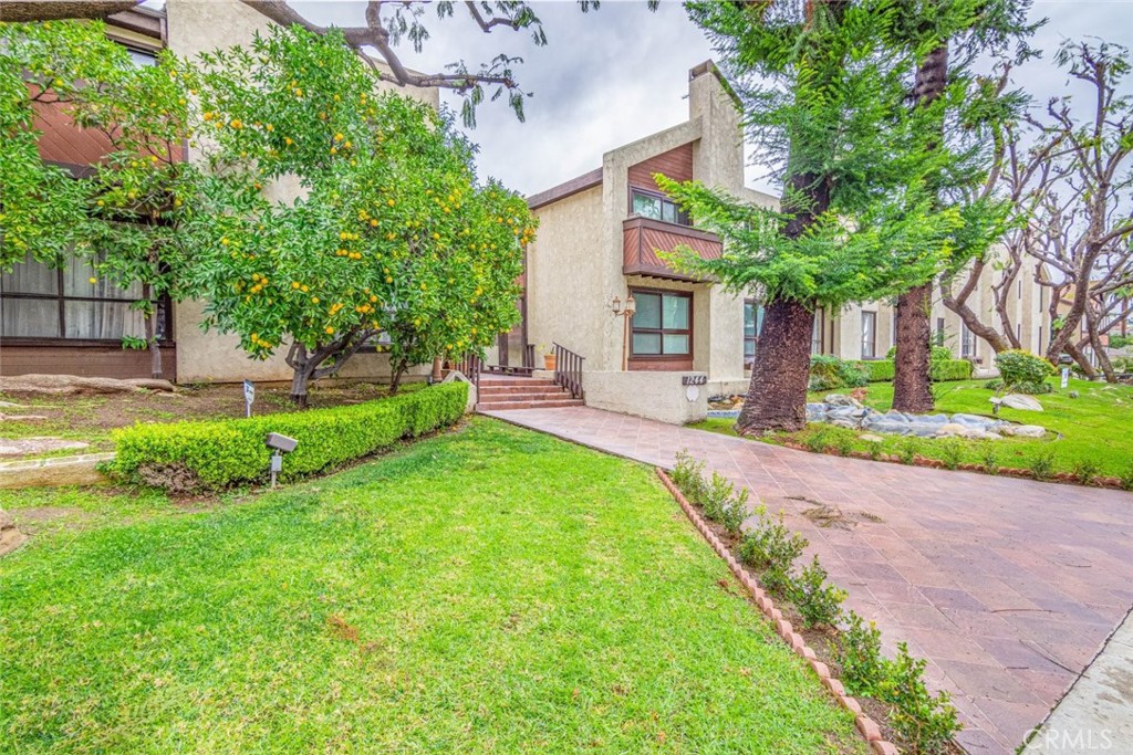1244 Valley View Road, Unit 129 Glendale, CA 91202 - Photo 4 of 42 a view of a house with a yard and a patio