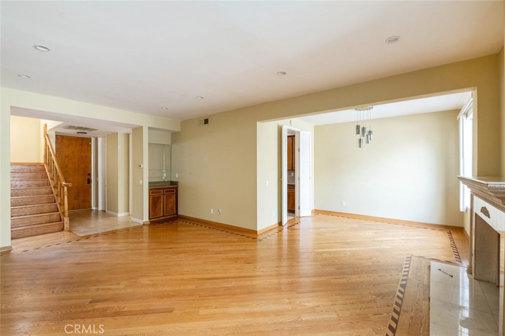 1244 Valley View Road, Unit 129 Glendale, CA 91202 - Photo 9 of 42 a view of an empty room with wooden floor and a window