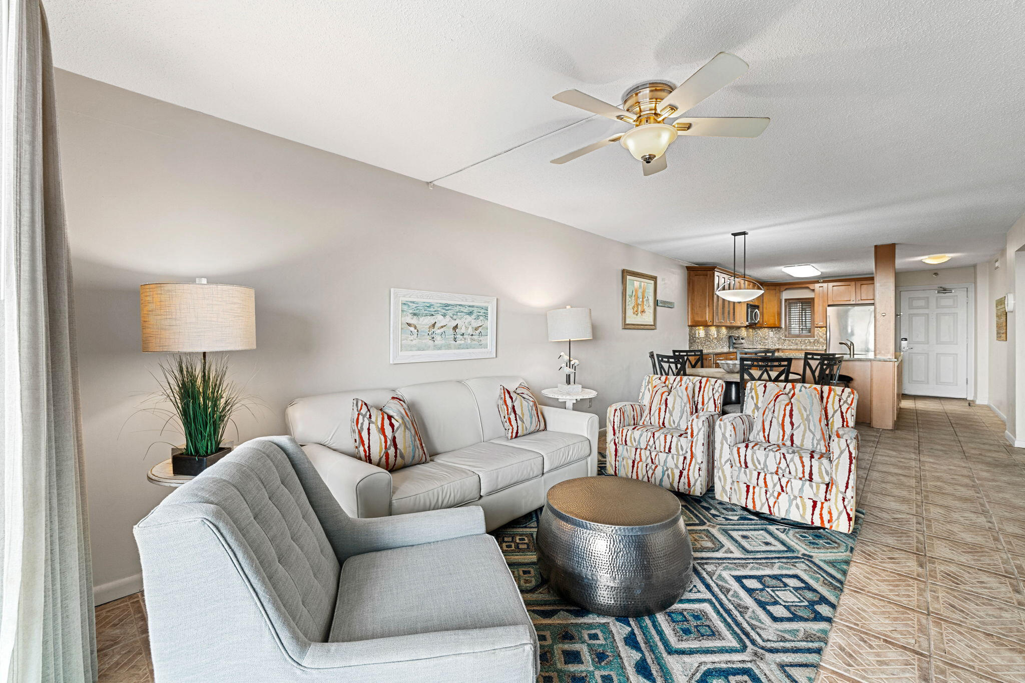 600 Gulf Shore Drive, Unit 304 Destin, FL 32541 - Photo 13 of 38 a living room with furniture and a chandelier