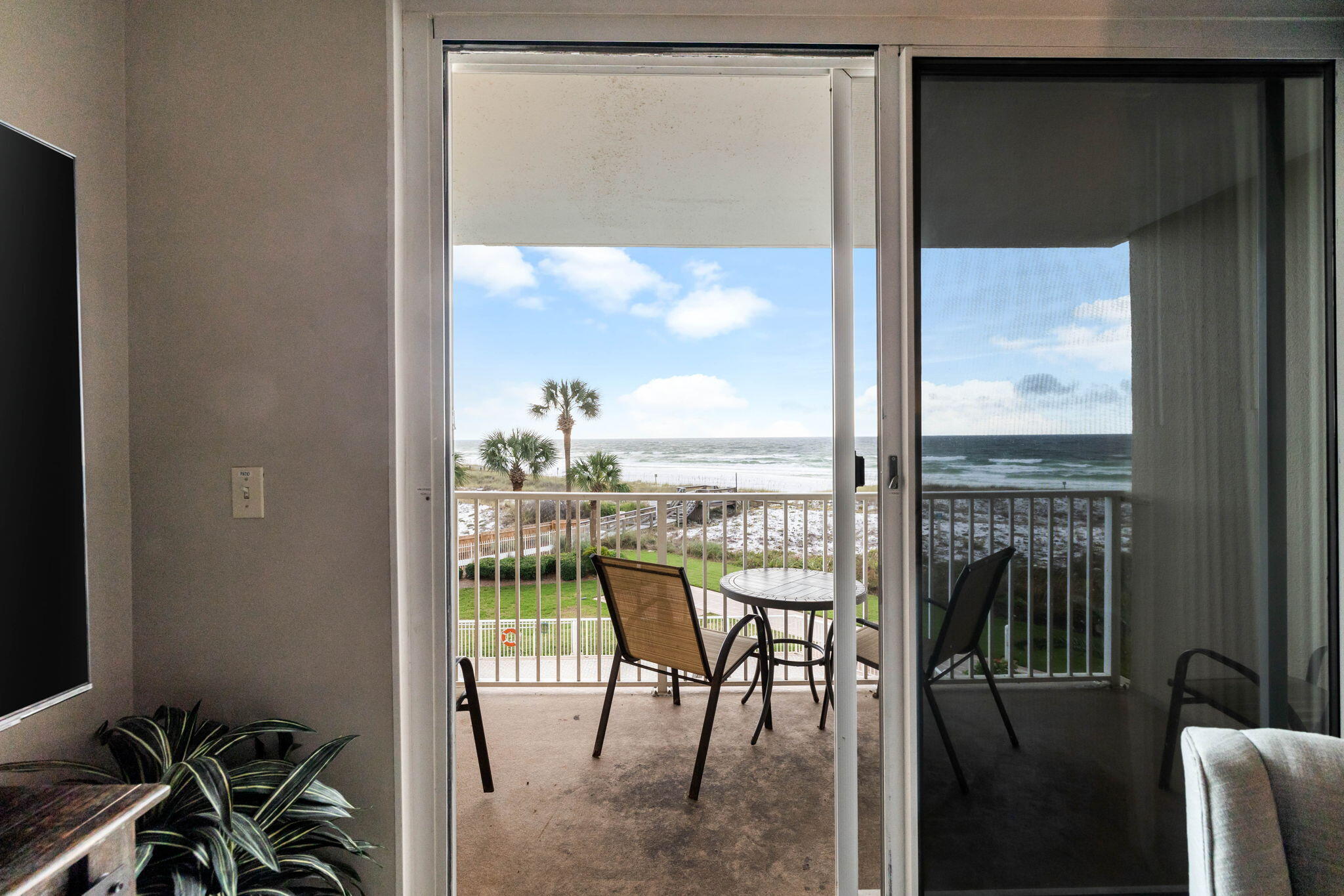 600 Gulf Shore Drive, Unit 304 Destin, FL 32541 - Photo 14 of 38 a view of a balcony with chairs and front door