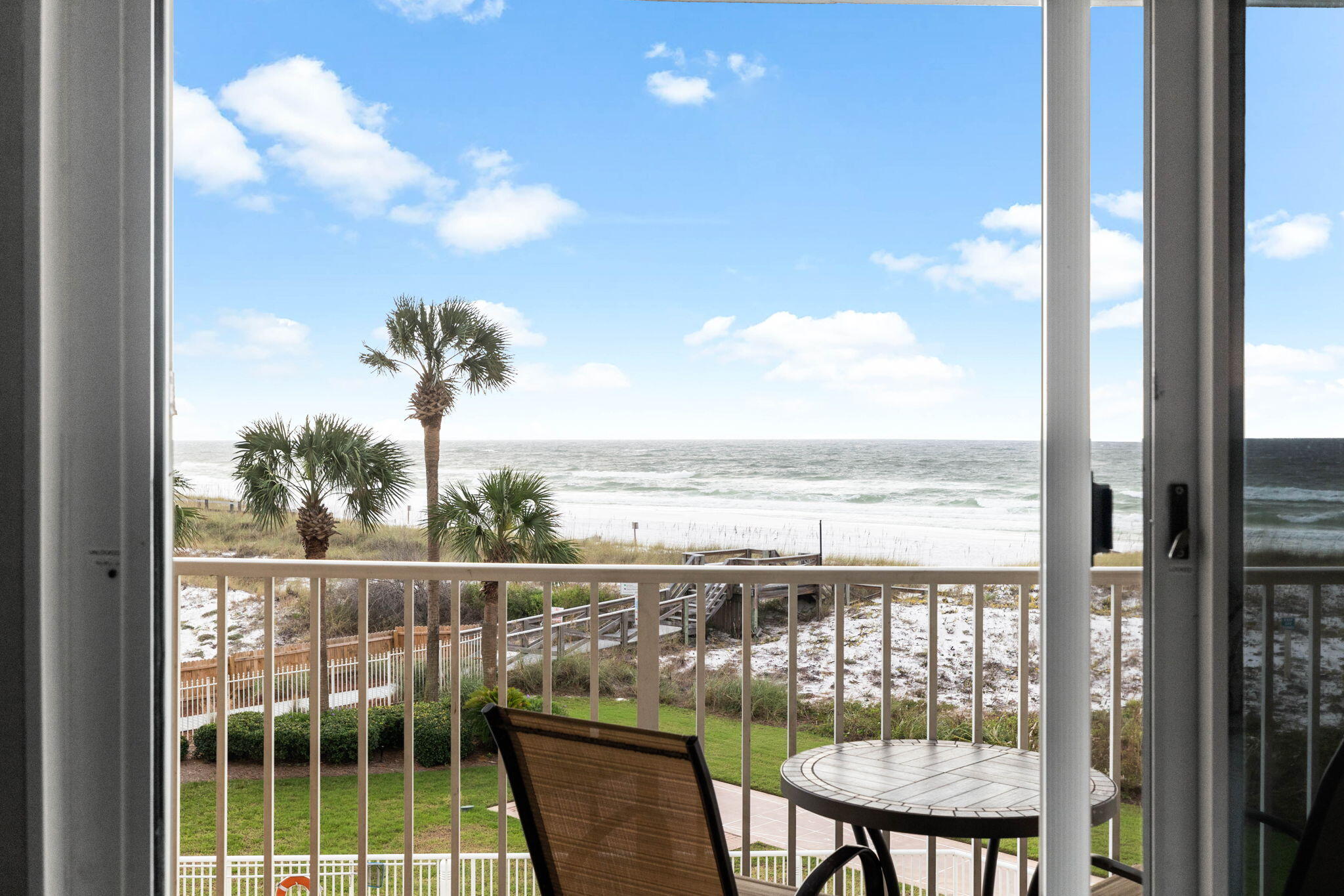 600 Gulf Shore Drive, Unit 304 Destin, FL 32541 - Photo 15 of 38 a view of a balcony with lake view and a potted plant
