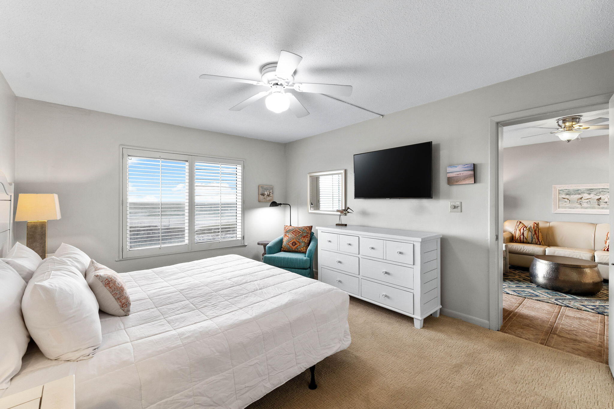 600 Gulf Shore Drive, Unit 304 Destin, FL 32541 - Photo 21 of 38 a bedroom with a bed and a flat tv screen on dresser
